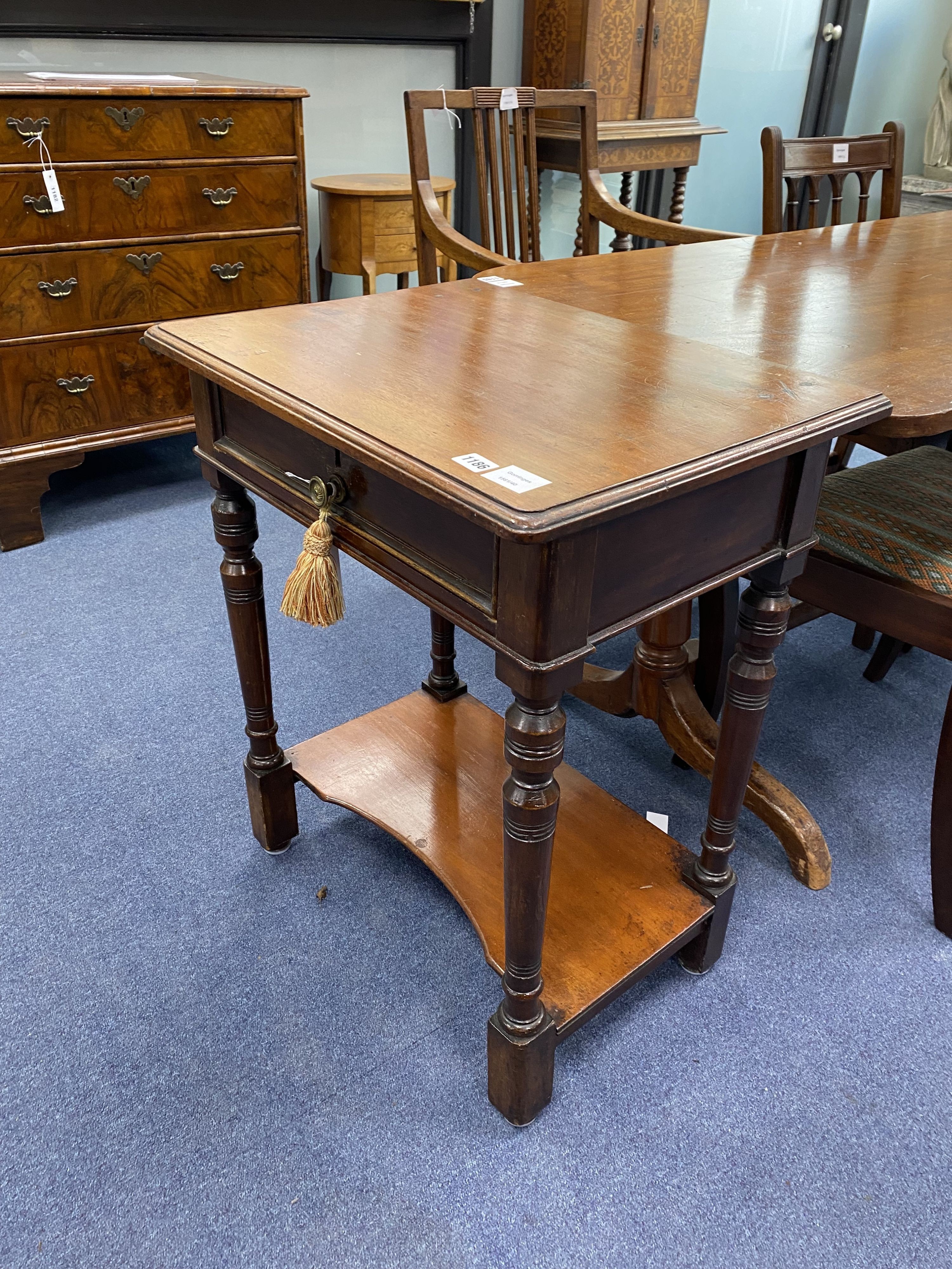 A small Victorian mahogany two tier side table, width 60cm, depth 43cm, height 72cm